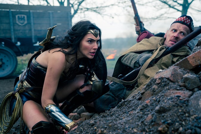 GAL GADOT as Diana and EWEN BREMNER as Charlie in the action adventure "WONDER WOMAN," a Warner Bros. Pictures release.