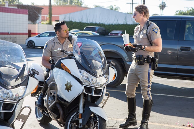 MICHAEL PEÑA as Ponch and DAX SHEPARD as Jon in Warner Bros. Pictures' action comedy "CHIPS," a Warner Bros. Pictures release.