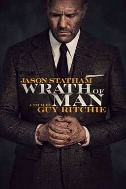Wrath of Man - Jason Statham and a film by Guy Ritchie - wearing suit with bloody hands clasped