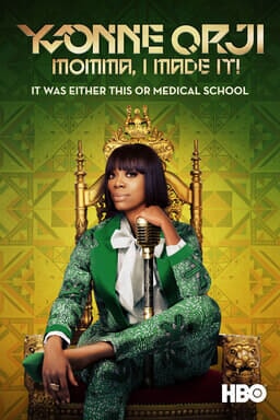 Yvonne Orji: Momma, I Made It! - Yvonne Orji in green patterned tux sitting on golden throne w mic