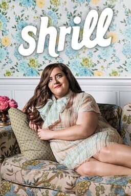 Shrill: Season 2 - Aidy Bryant as Annie in a short dress poised on the couch looking up